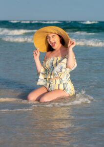 A fun senior picture shot in the waves on Destin beach.