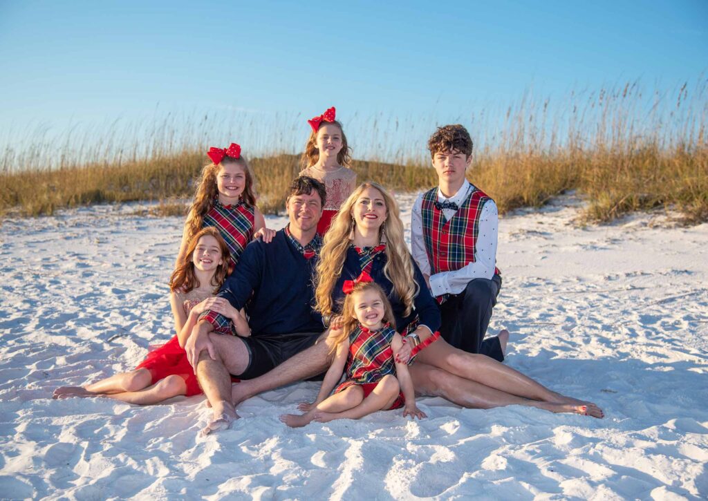 Posing by the sand dunes in Christmas outfits