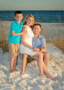 Happy family at beach after surprise proposal