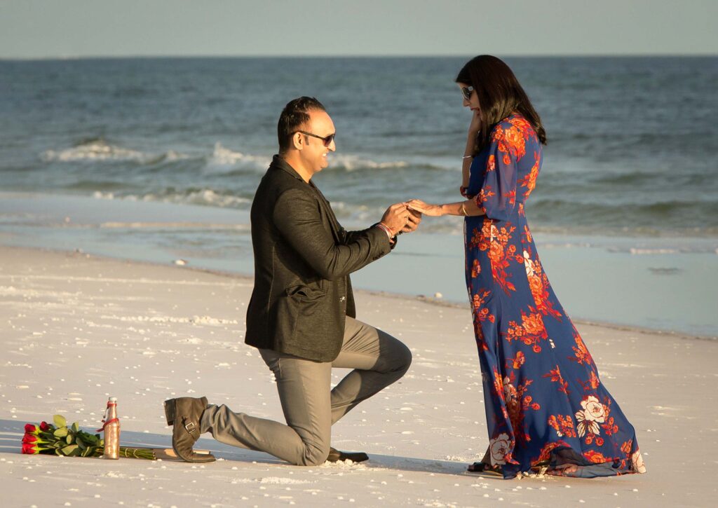 Couple getting engaged on Destin beach