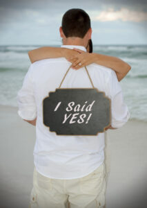 Surprise Proposal on beach by photographers in Destin