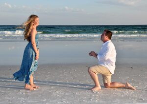 Beach proposal photo shoot in Destin with man on one knee