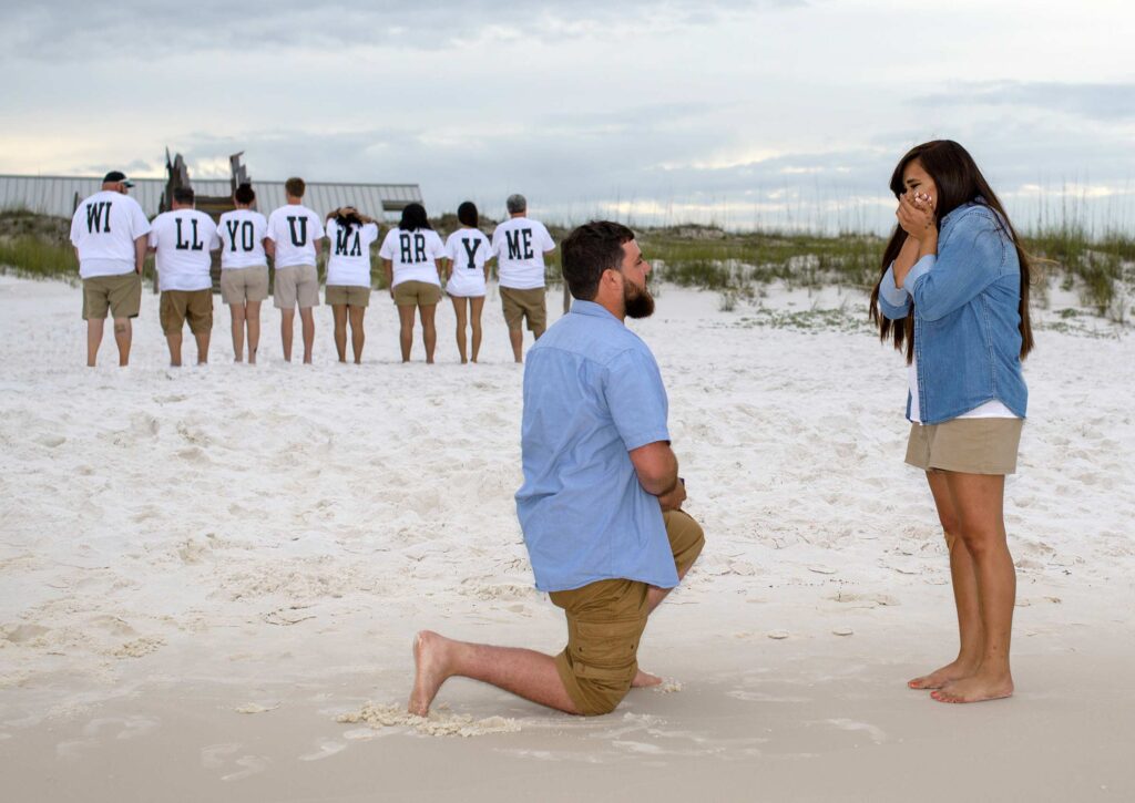 T-shirts on family spell out will you marry me