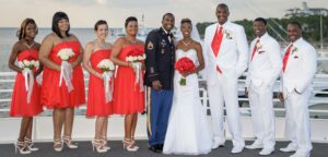 The bride, groom, and wedding party by the Gulf of Mexico