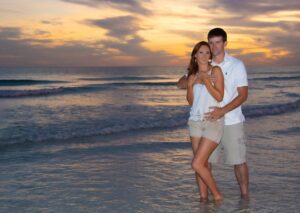 Engagement photographers in Destin, FL - Couple on the beach at sunset