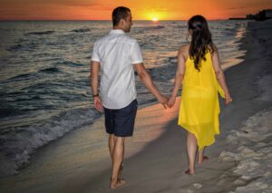 Beach sunset engagement photos - couple on beach