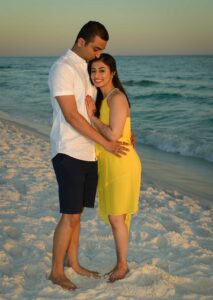 Engagement photographers Destin Florida - couple embracing on beach