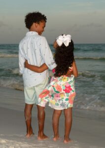 Kids posing for their autumn beach portrait