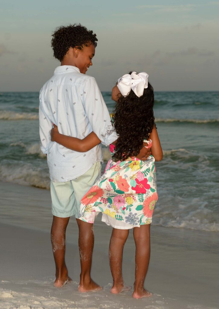 Kids posing for their autumn beach portrait