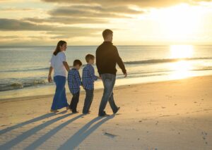 Family sunset photo at the beach