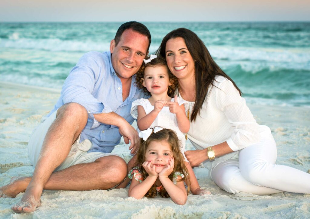 Family of four beach photo.