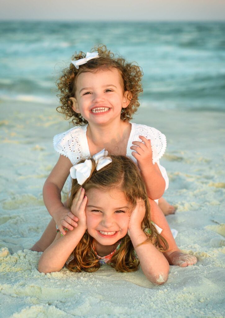 30A photographer captures sisters on beach.