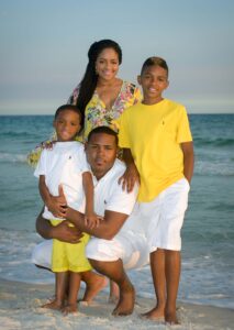 Family standing near water