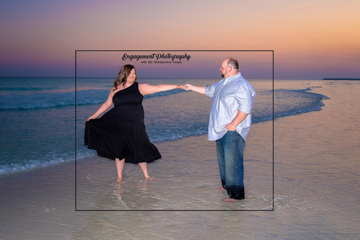 Engagement Photographer in Destin captures couple dancing on beach.